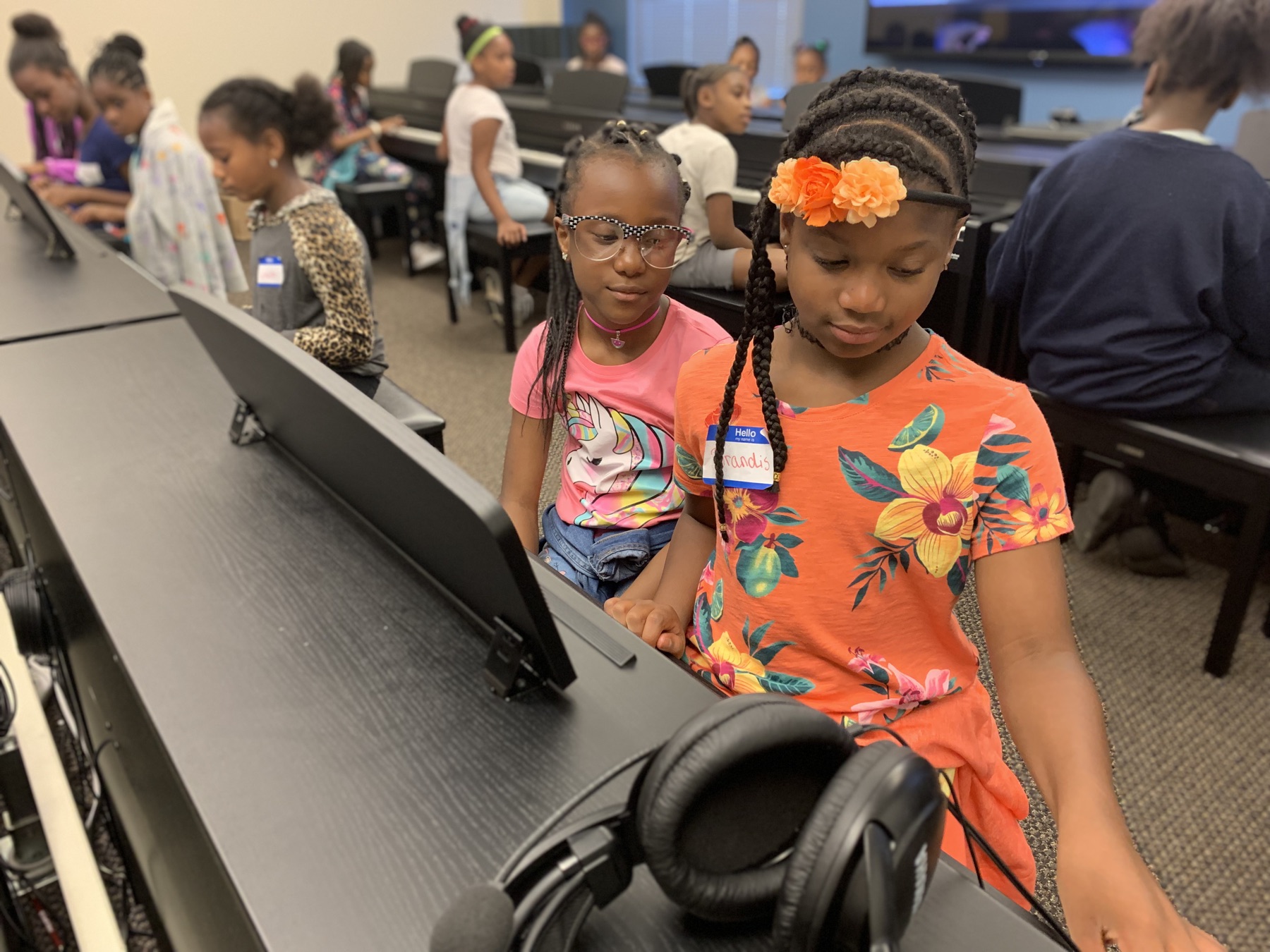 Girls STEM Institute scholars working together at computers